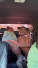 Sweet lesbian ebony cuties are having fun in the backseat.