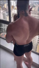 Athletic bitch kneels down to deeply suck his prominent cock